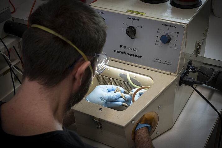 Closeup of working on the sandblaster